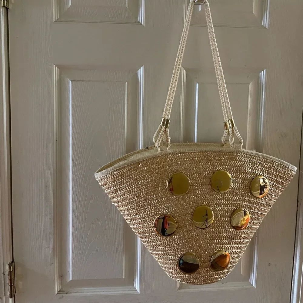 Natural straw bucket style tote bag with rope straps with gold tone acce…